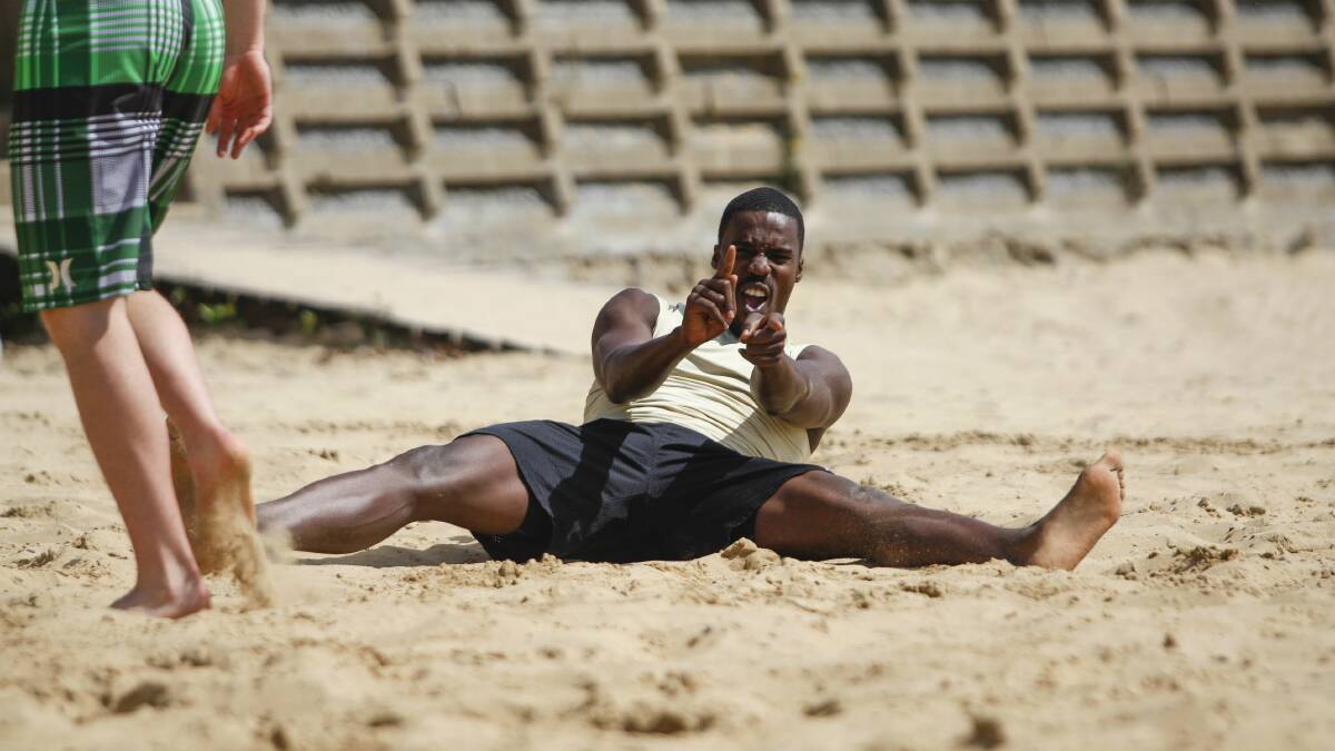 Hawks import Kevin Tiggs enjoys himself playing volleyball at North Wollongong Beach. Picture: CHRISTOPHER CHAN