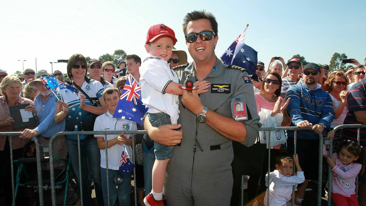 Ryan Campbell arrives to a hero's welcome at Illawarra Regional Airport after completing his around the world flight today. Pictures: GREG TOTMAN