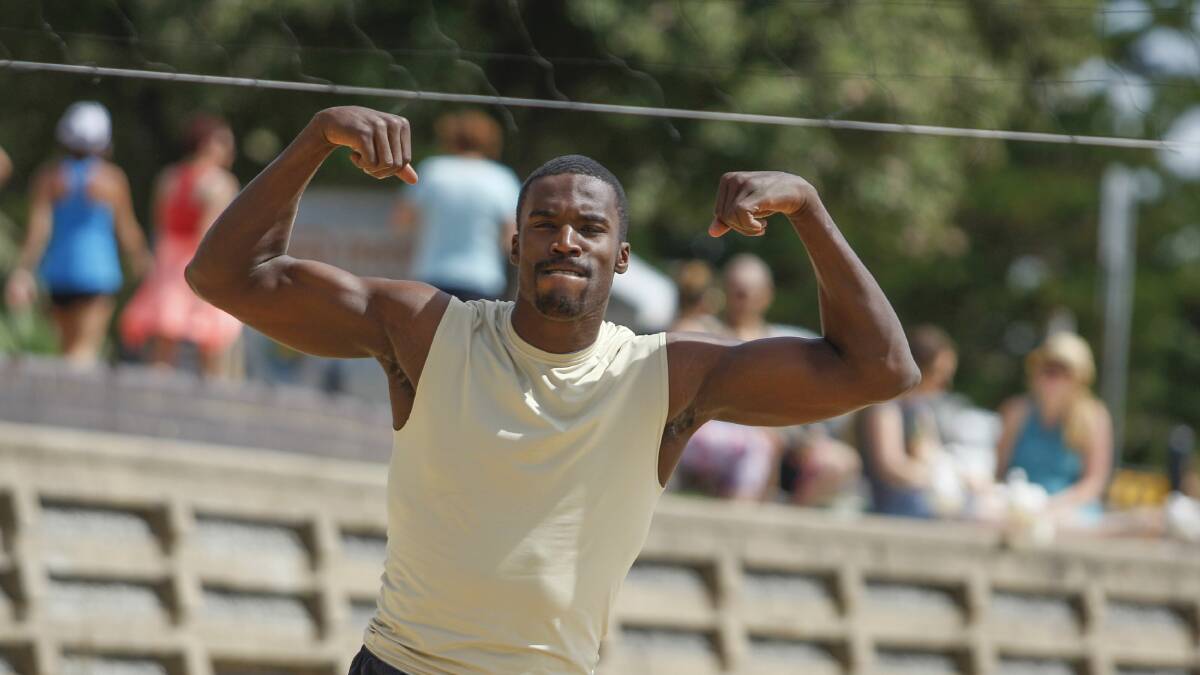 Kevin Tiggs plays up to the camera during a beach volleyball session with the Hawks yesterday. Picture: CHRISTOPHER CHAN  