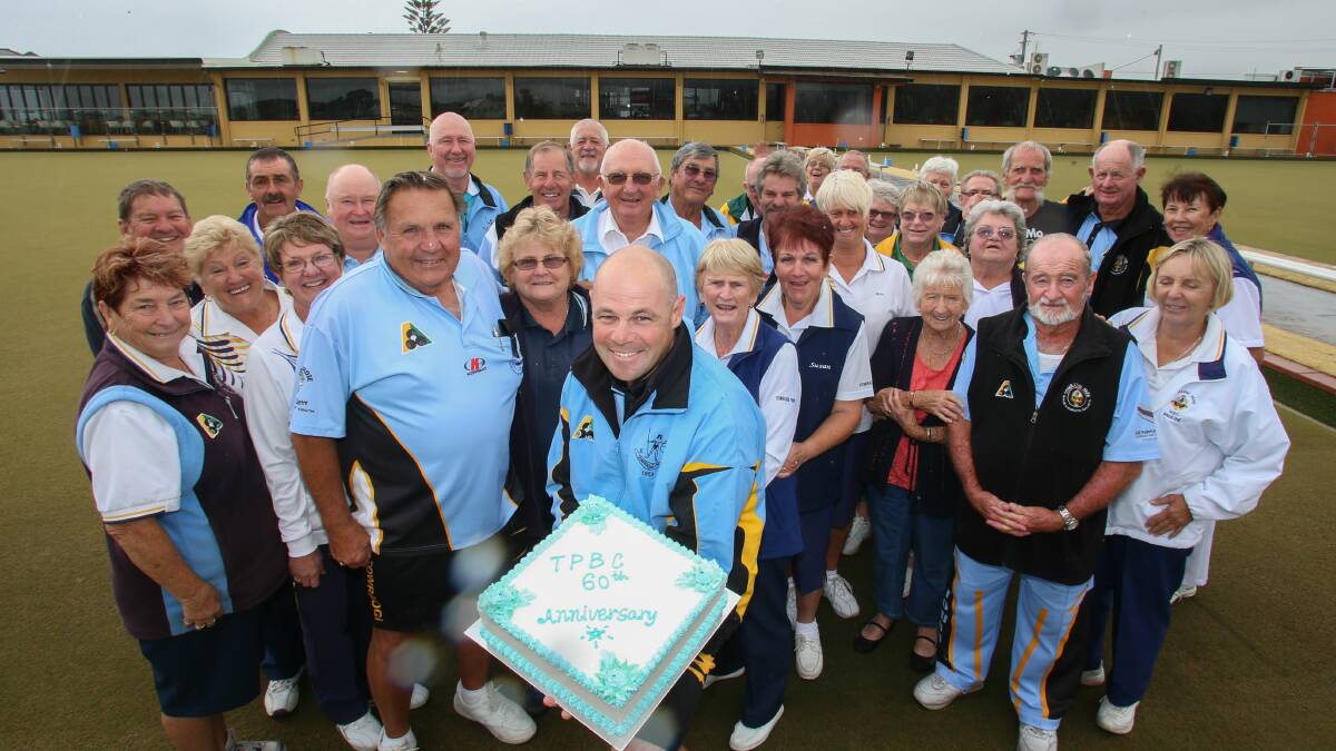 Towradgi Park members join  Wes Falconer with a birthday cake celebrating the club’s 60th anniversary. Picture: ADAM McLEAN