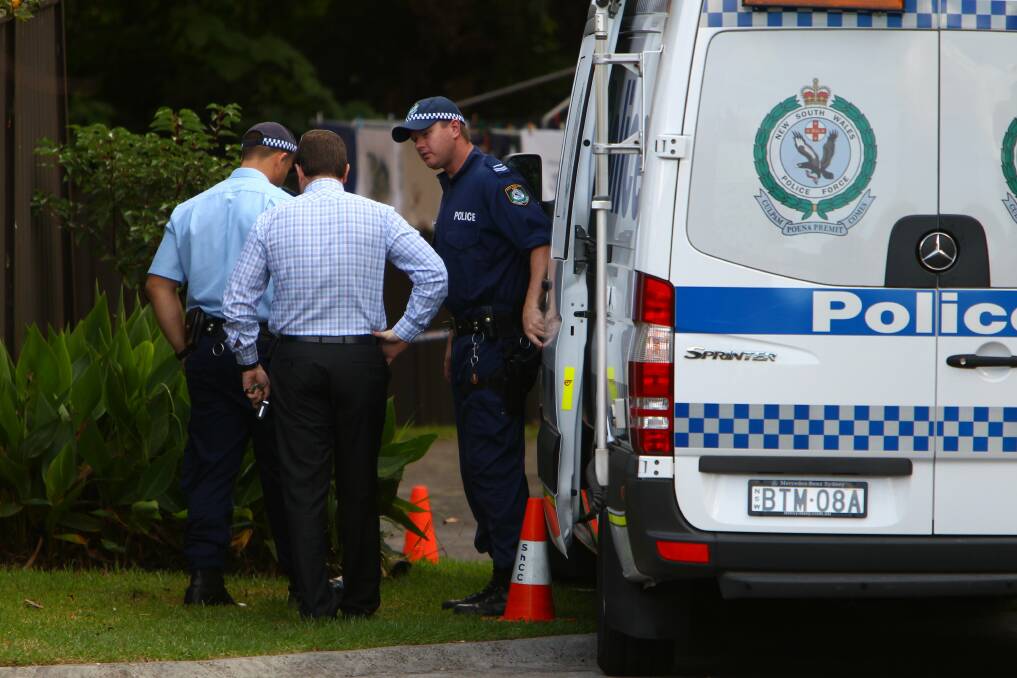 Police at Bligh St, Wollongong, where the murdered woman lived. Picture: KEN ROBERTSON