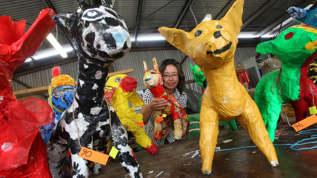 Artist Mai Nguyen-Long with her mongrel creations. Picture: KEN ROBERTSON
