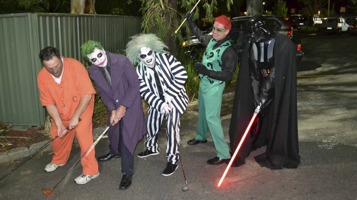 The Villains practise their putting ahead of tomorrow night's show at the Port Kembla Golf Club.