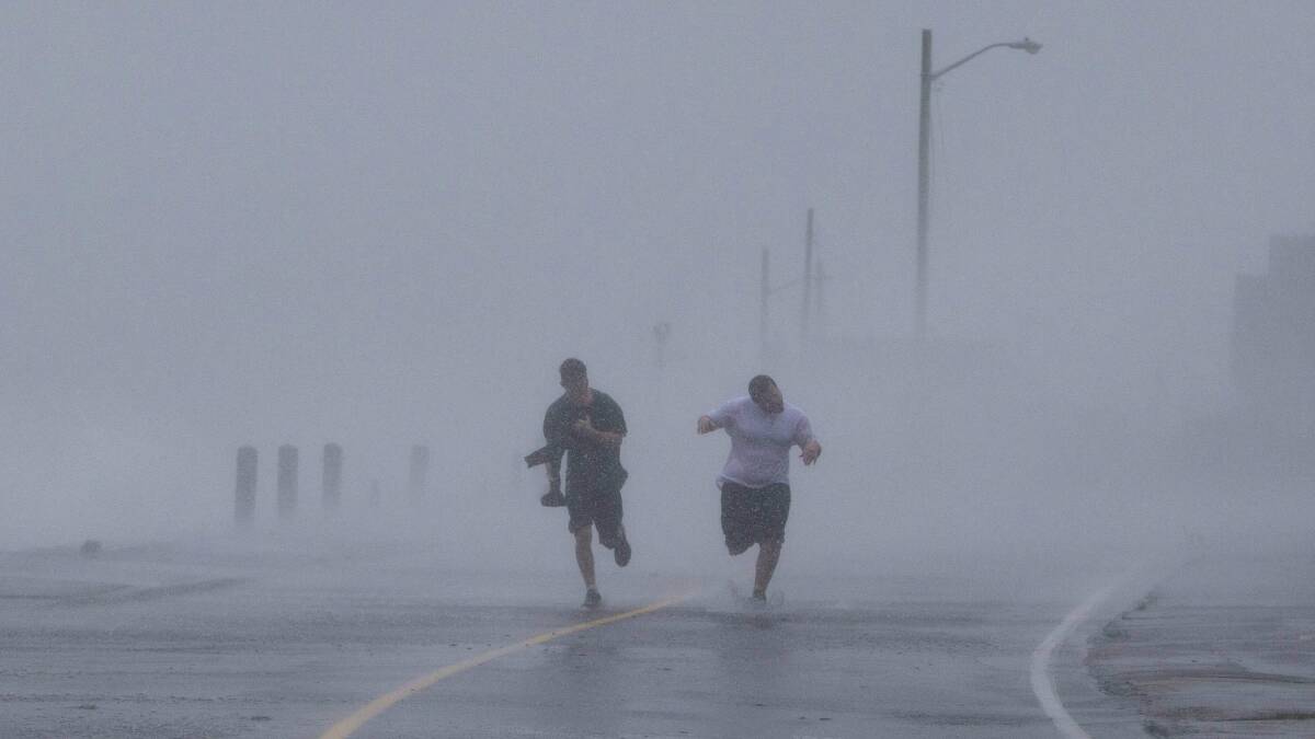 Two boys brave the weather in Massachusetts. Picture: REUTERS