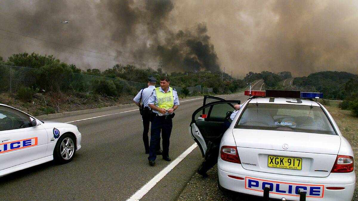 Police man a road block on the Princes Highway on Boxing Day, 2001. Picture: REUTERS