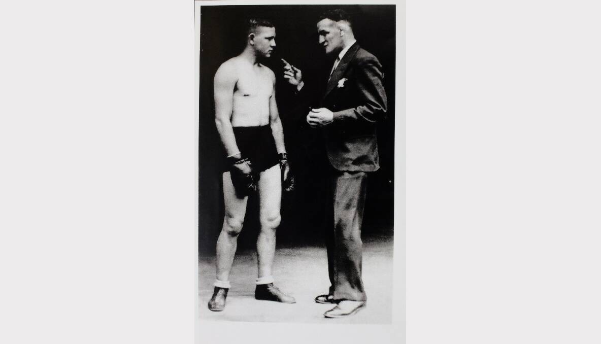 Russ Critcher in his heyday, gloved up and ready to fight. The identity of the man in the suit is lost to time.