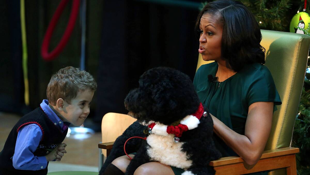 US First Lady Michelle Obama reads to children in Washington, DC. Picture: GETTY IMAGES