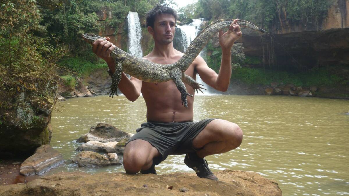  Outdoorsman Andrew Ucles with a nile monitor encountered during his 2012 African adventure.