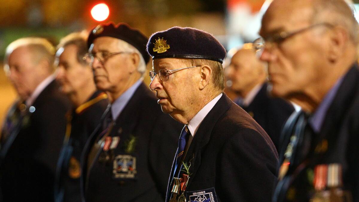 Thousands paid tribute to the Anzacs at the Wollongong dawn service. Pictures: KEN ROBERTSON