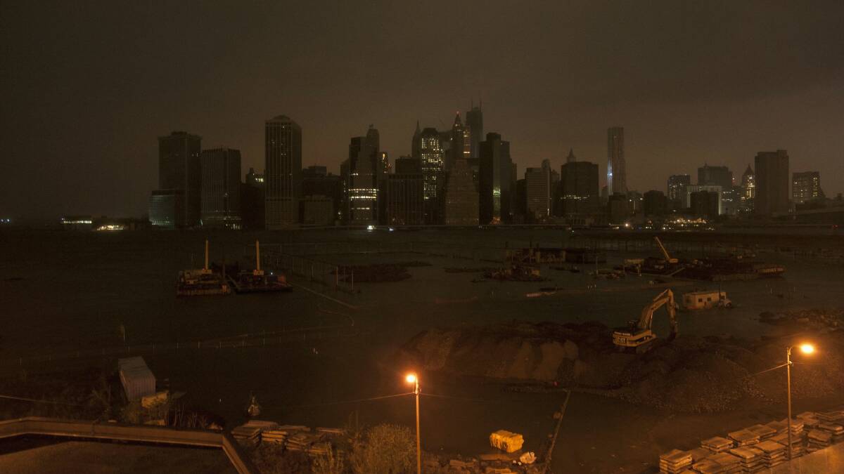 The dark Manhattan skyline after the power was turned off. Picture: REUTERS