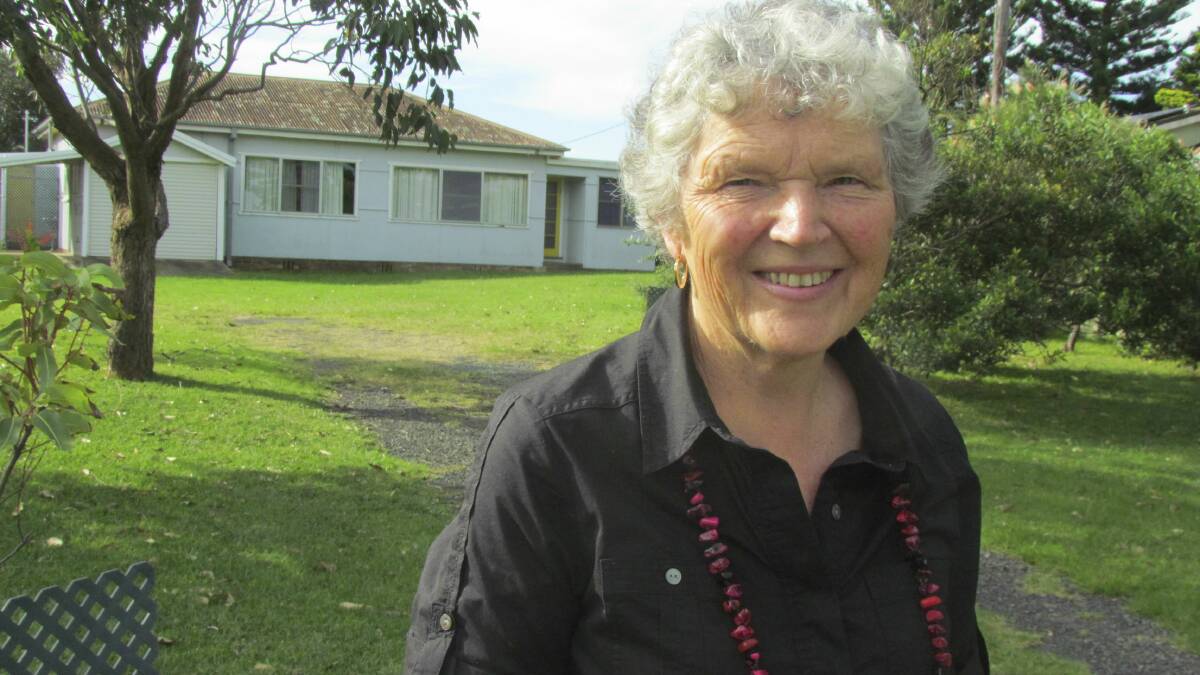 Bobbie Miller in front of the Werri Beach home of the revered Australian landscape artist Lloyd Rees.