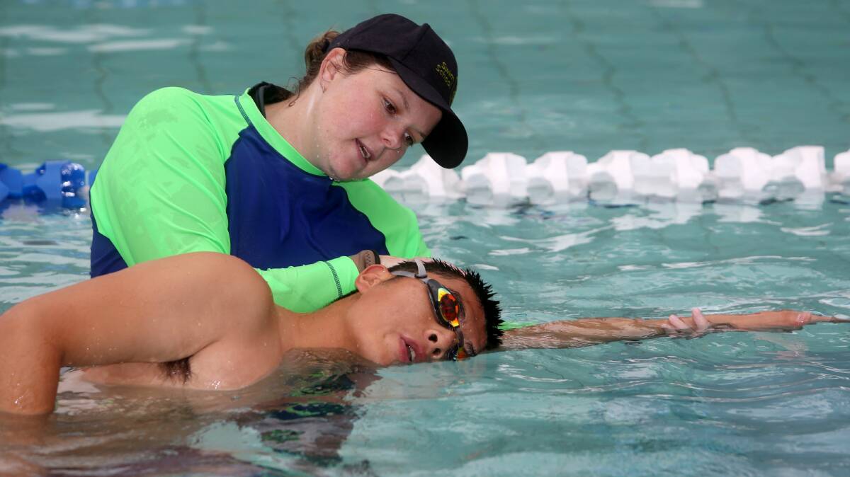 Instructor Erin Faricy guides University of Wollongong student Jichao "Jimmy" Zhang. Picture: ROBERT PEET