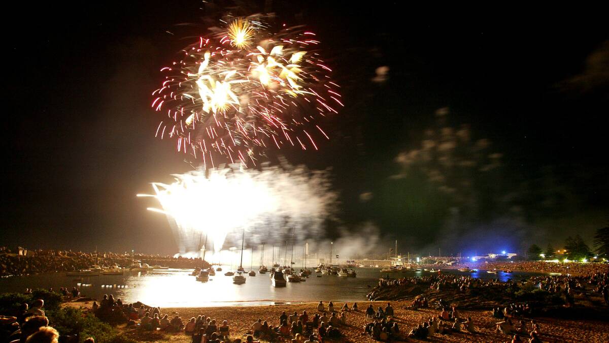 The crowd watches the fireworks at Belmore Basin last year.