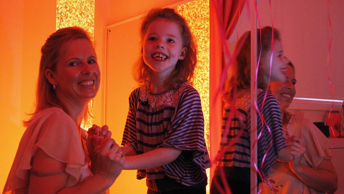 Kayla Chaseling, 6, and her mum, Anna, enjoy the youngster’s sensory room. Picture: ANDY ZAKELI
