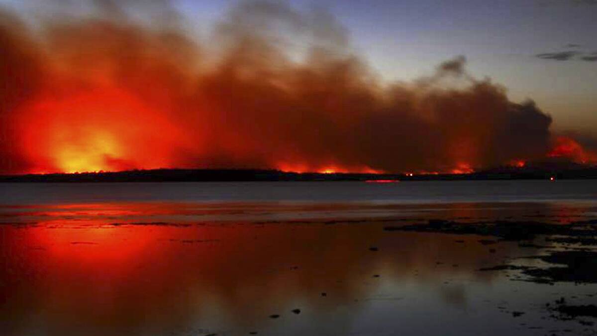The Deans Gap bushfire burns near Sussex Inlet last week. Picture: NSW RURAL FIRE SERVICE