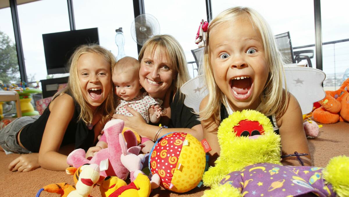 Danielle Solomon with daughters Charlotte, 8, Bridget, seven months, and Lucinda, 4.  Picture: DAVE TEASE 