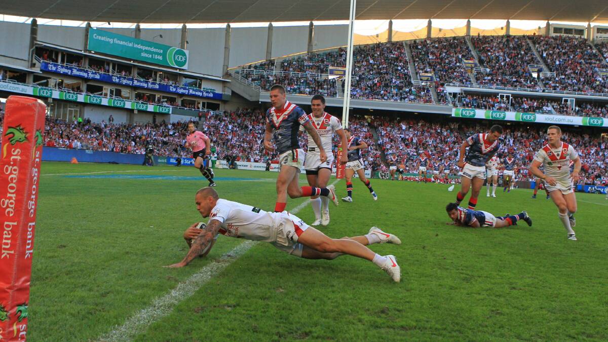 Matt Cooper scores a try against the Roosters in 2012. Picture: Steve Christo