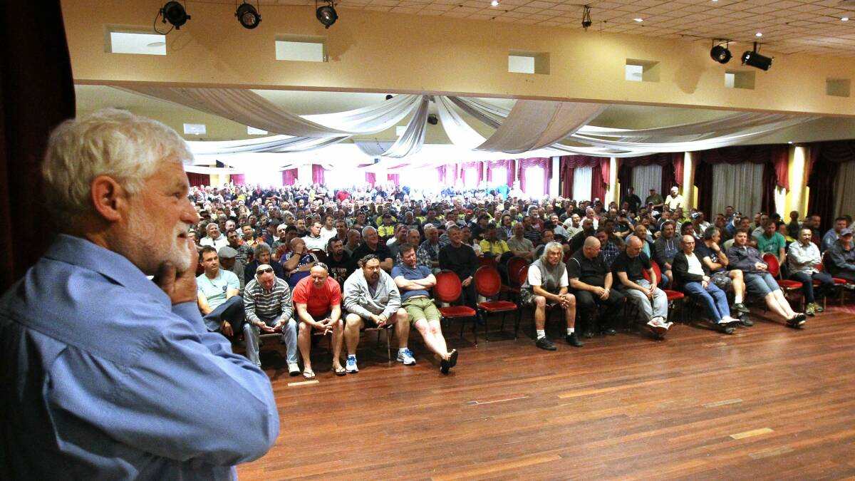 Union leader Wayne Phillips with a crowd of Bluescope workers at a meeting last month. 