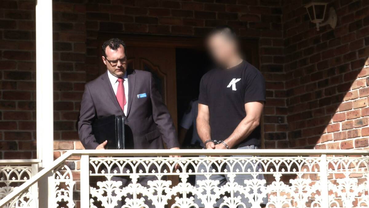 Police arrest the second man this morning. Picture: NSW POLICE