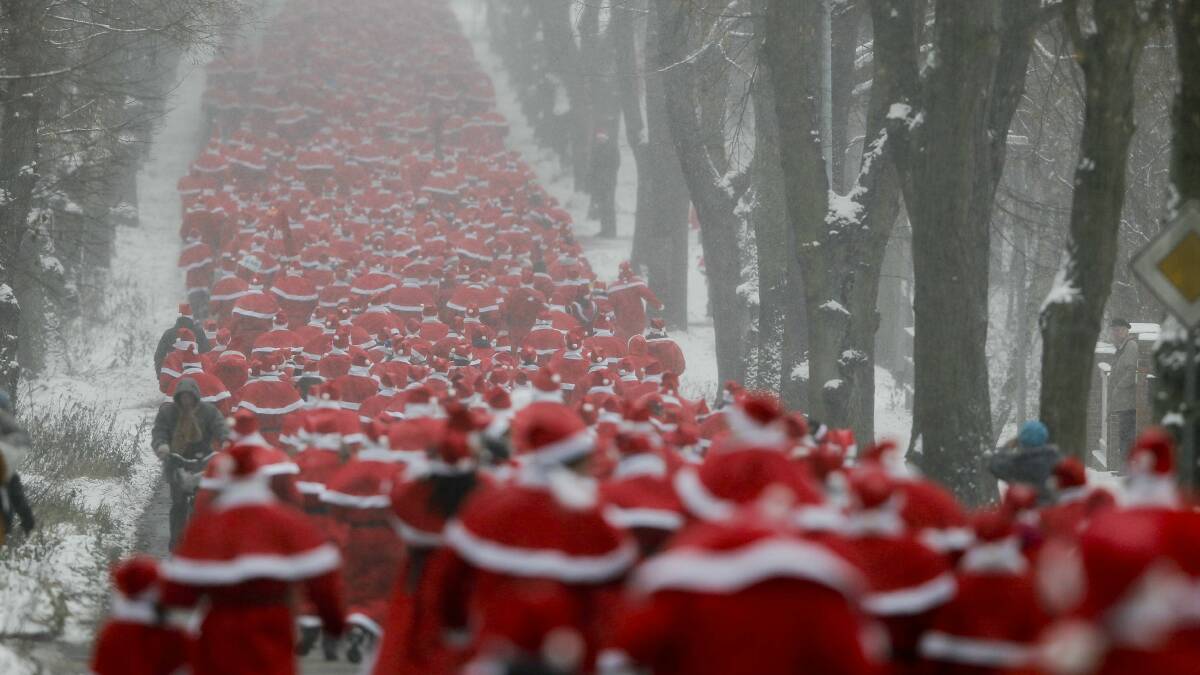 Runners dressed as Santa take part in a race in Berlin. Picture: REUTERS