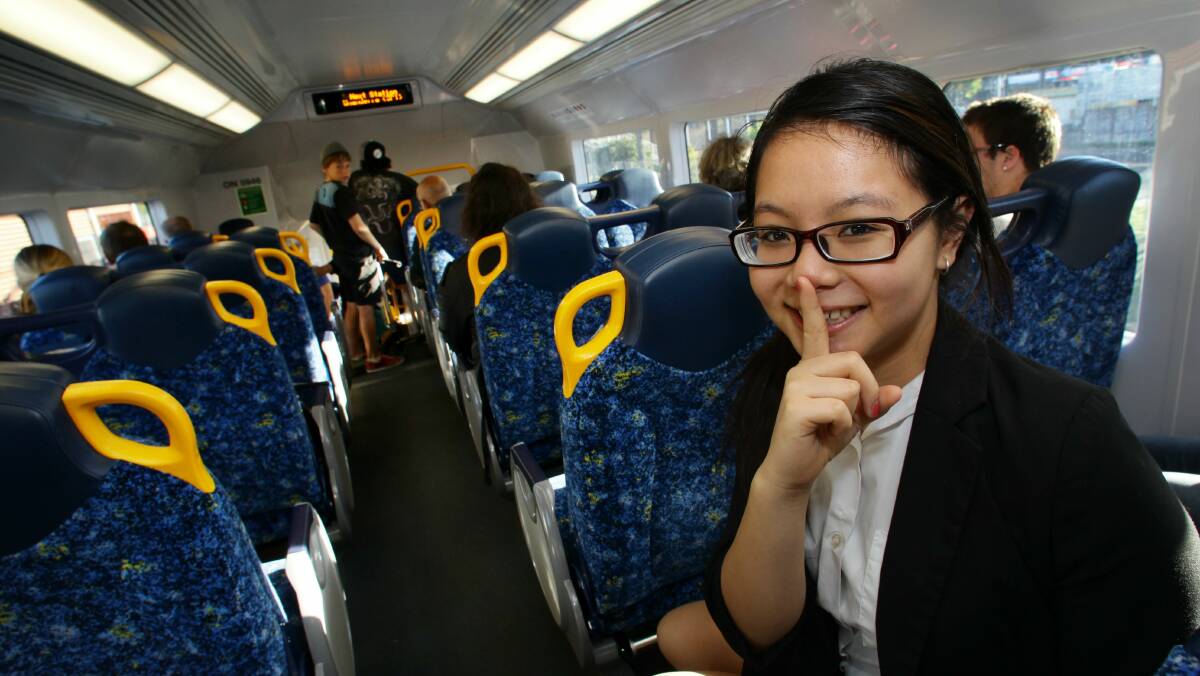 Commuter Jasmine Zhu in May 2012, when quiet carriages were introduced on the South Coast line. Picture: KEN ROBERTSON