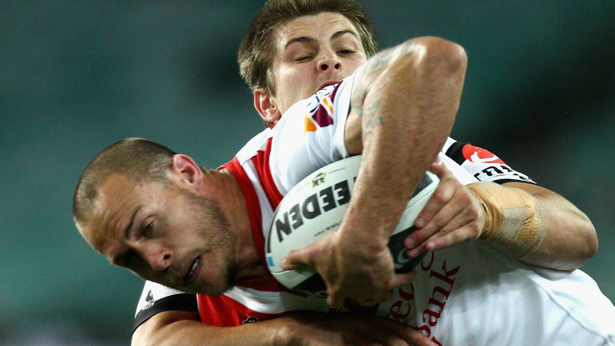 Matt Cooper is tackled by Blake Ayshford of the Tigers in 2011. Picture: Getty Images