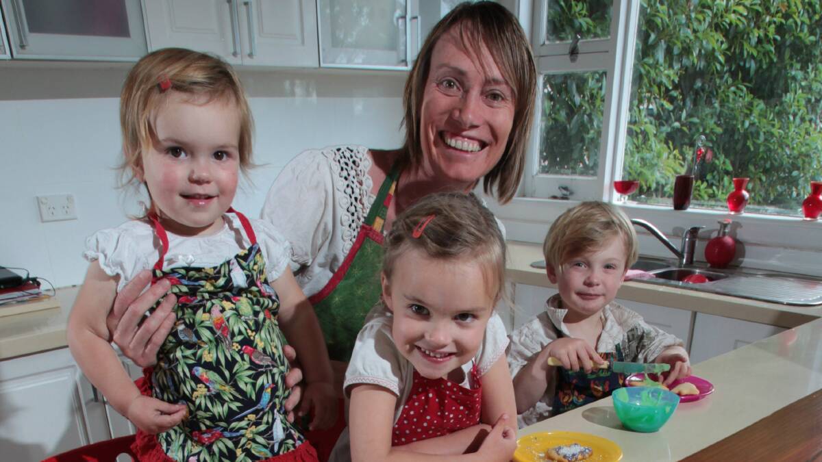 Jenny Black in the kitchen with her children Maggie, Poppy and Soli. Pictures: KEN ROBERTSON