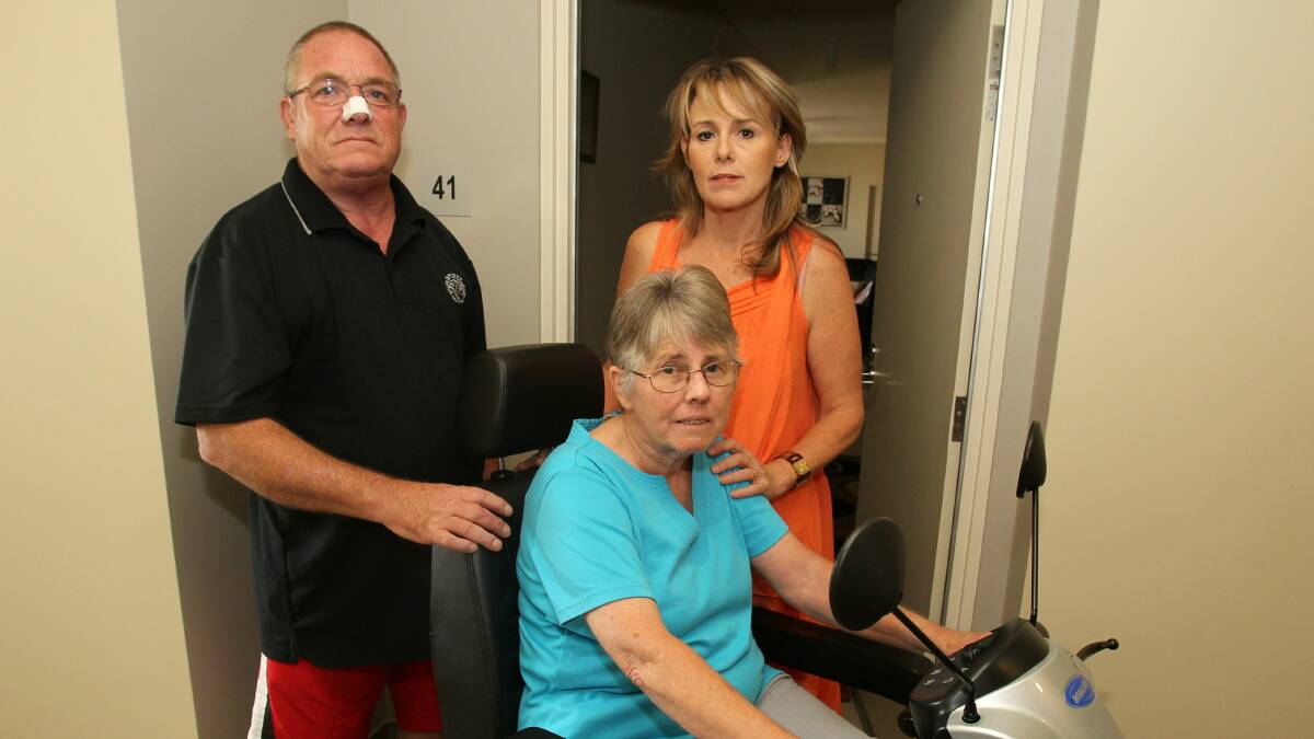 Councillor Vicki Curran with residents George and Sandra Lee, who are among those stranded. Picture: GREG TOTMAN