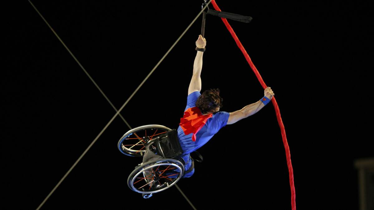Paul Nunnari climbs a silk rope before performing an aerial display above Crown Street Mall. Picture: SYLVIA LIBER