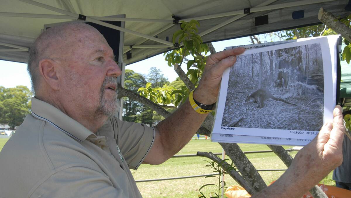 Berry landholder Bill Pigott inspects images of wildlife taken with motion-activated cameras. Picture: JESSICA LONG