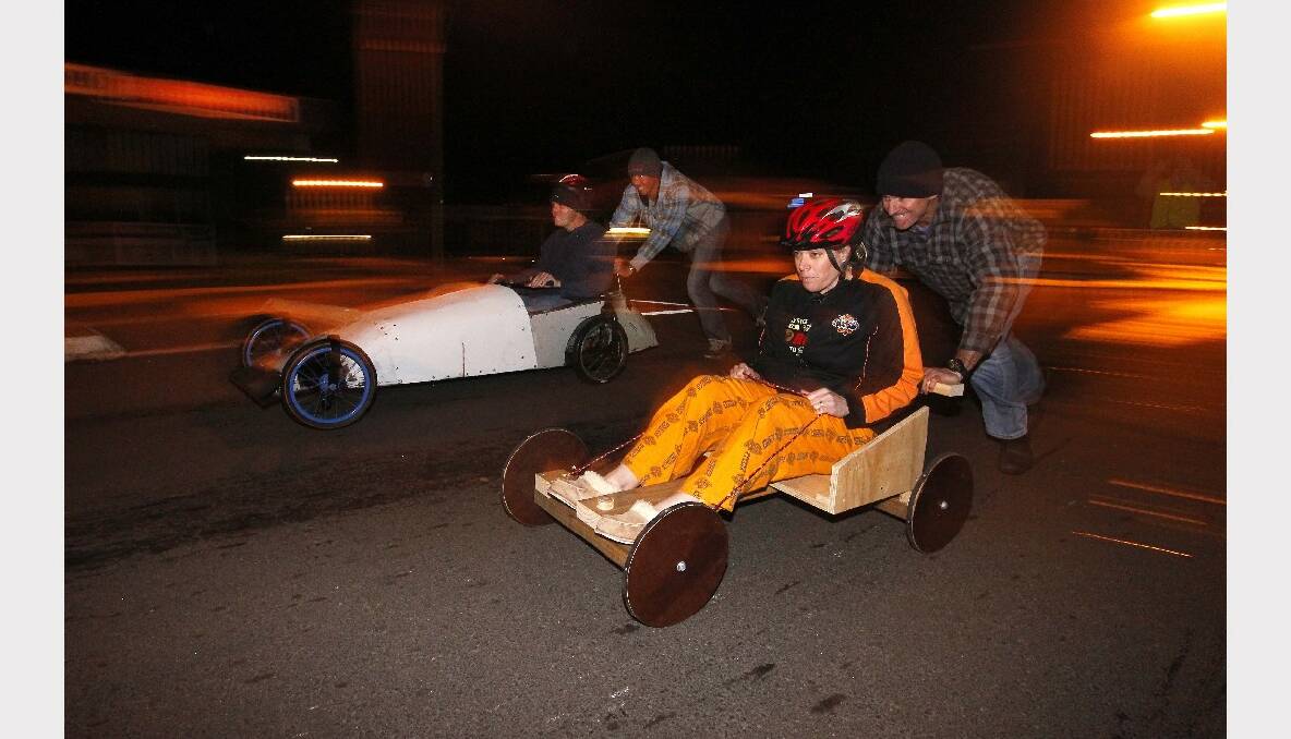 Dads perform some secret night testing after a prototype cart was built for the kids.