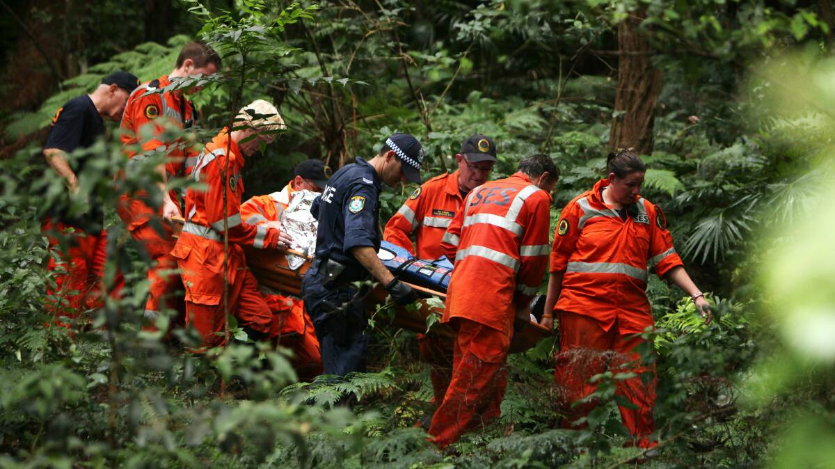 SES, police and paramedics carry Arno Badziong out of bushland near Austinmer. Picture: KIRK GILMOUR