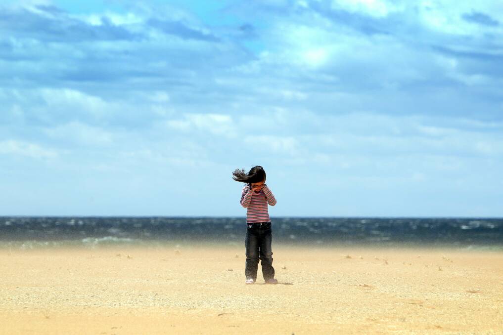 Young Ebony plays on Bombo Beach in December. Picture: SYLVIA LIBER