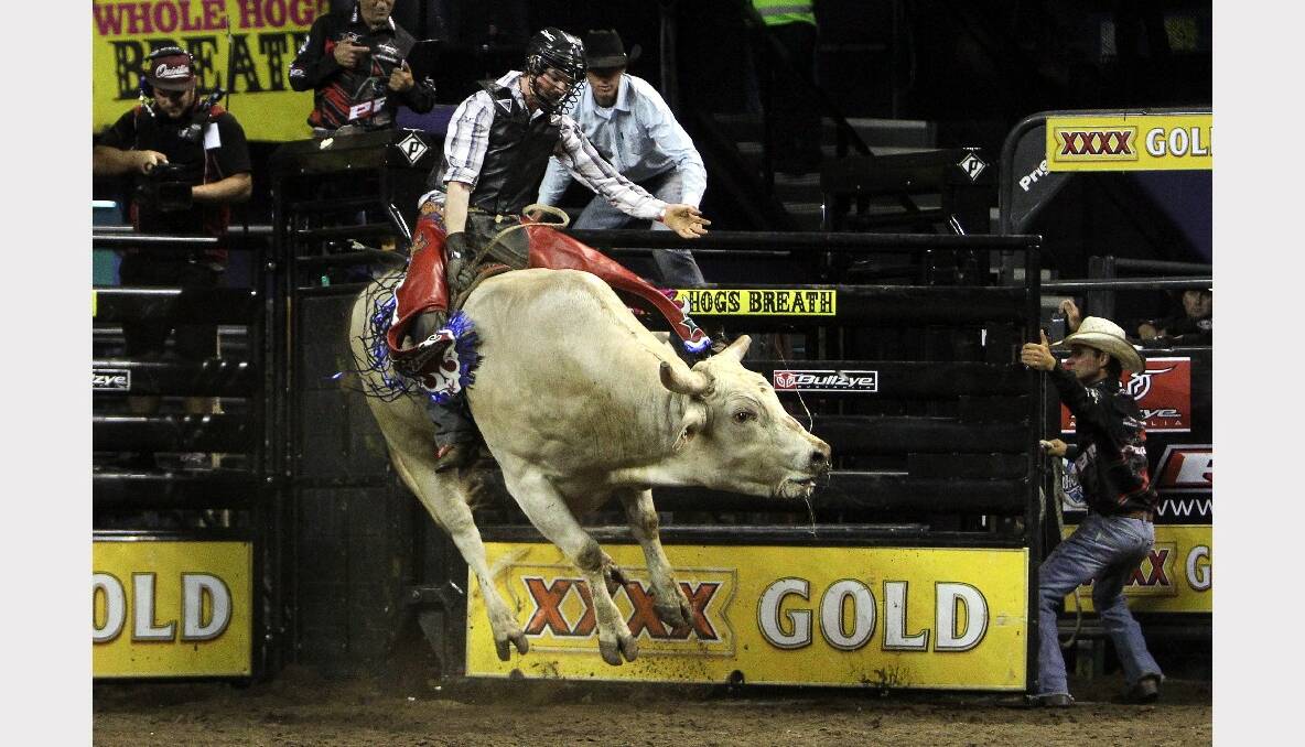 Joe Polkinghorne rides in the Professional Bull Riding competition at the WEC. Picture: SYLVIA LIBER 