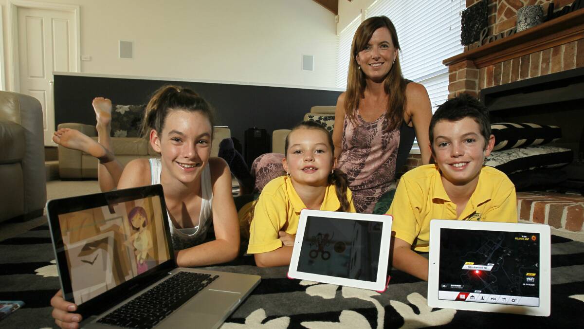 Georgia, 13, Tylah, 7, and Cooper, 11, with mum Julie Lee, are happy with the speedier connection. Picture: DAVE TEASE