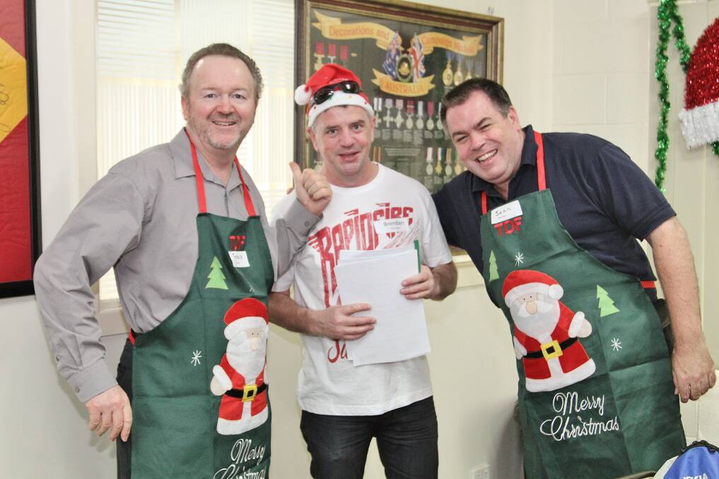 Francis Handcock, Brendan Bermingham and Sean Richards at the DENNY Foundation's Christmas Day lunch. Picture: GREG ELLIS