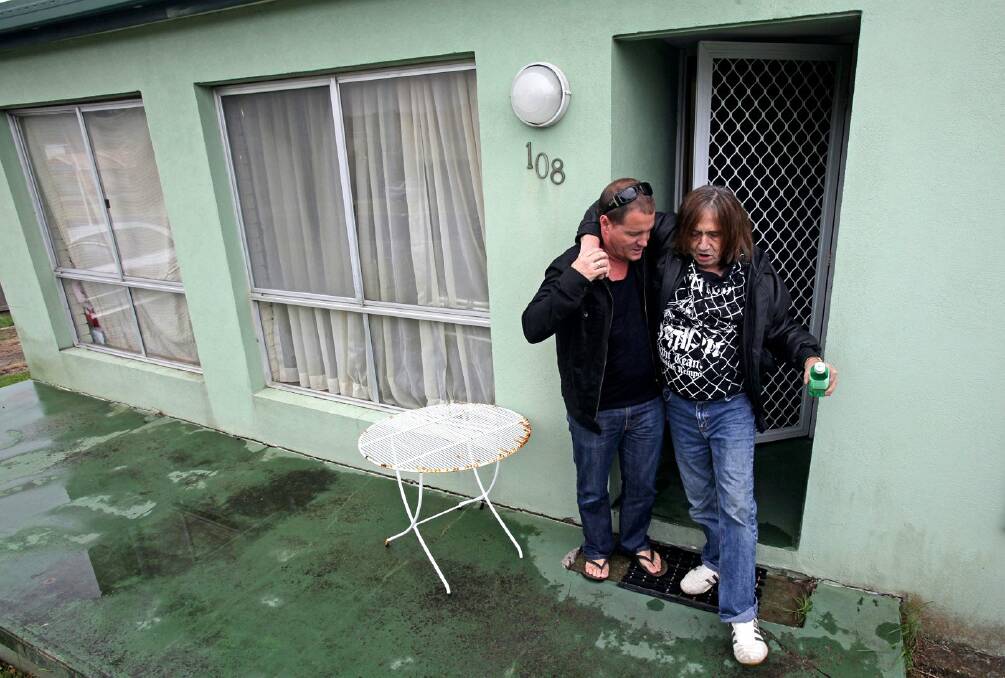Singer-actor Scott McRae assists Stevie Wright of the Easybeats at his South Coast home in February. Picture: KIRK GILMOUR