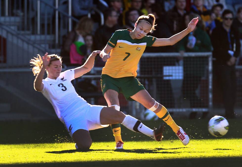 Australia's Caitlin Foord battles New Zealand's Anna Green in June. Picture: ORLANDO CHIODO