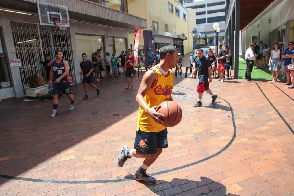 Cafe workers compete with each other during the Globe Lane cafe basketball tournament. Picture: ADAM McLEAN