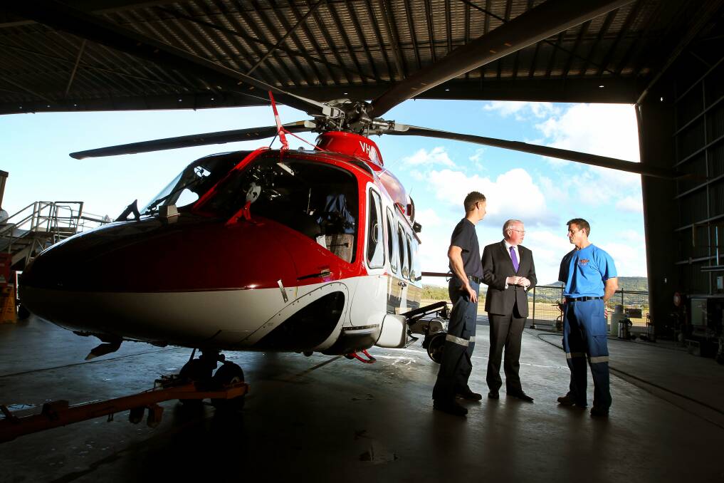 Gareth Ward with base manager Nathan Haythorpe and Ambulance NSW station manager Andrew Ryan.
