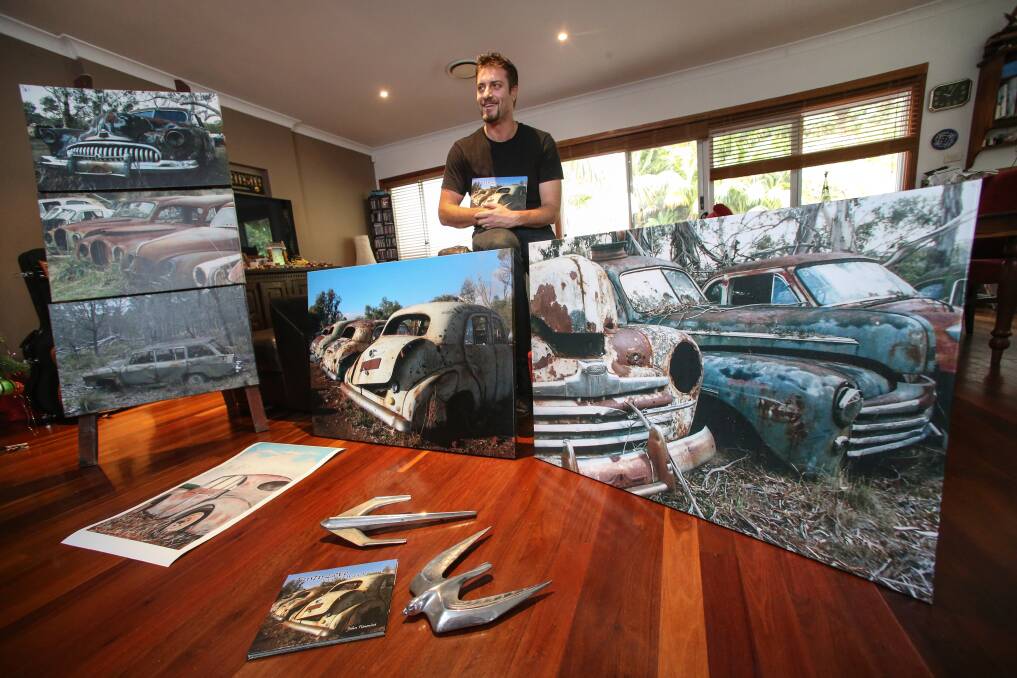 John Timmins, of Keiraville, with images from his book of photography, Rusty Love. Picture: ADAM McLEAN
