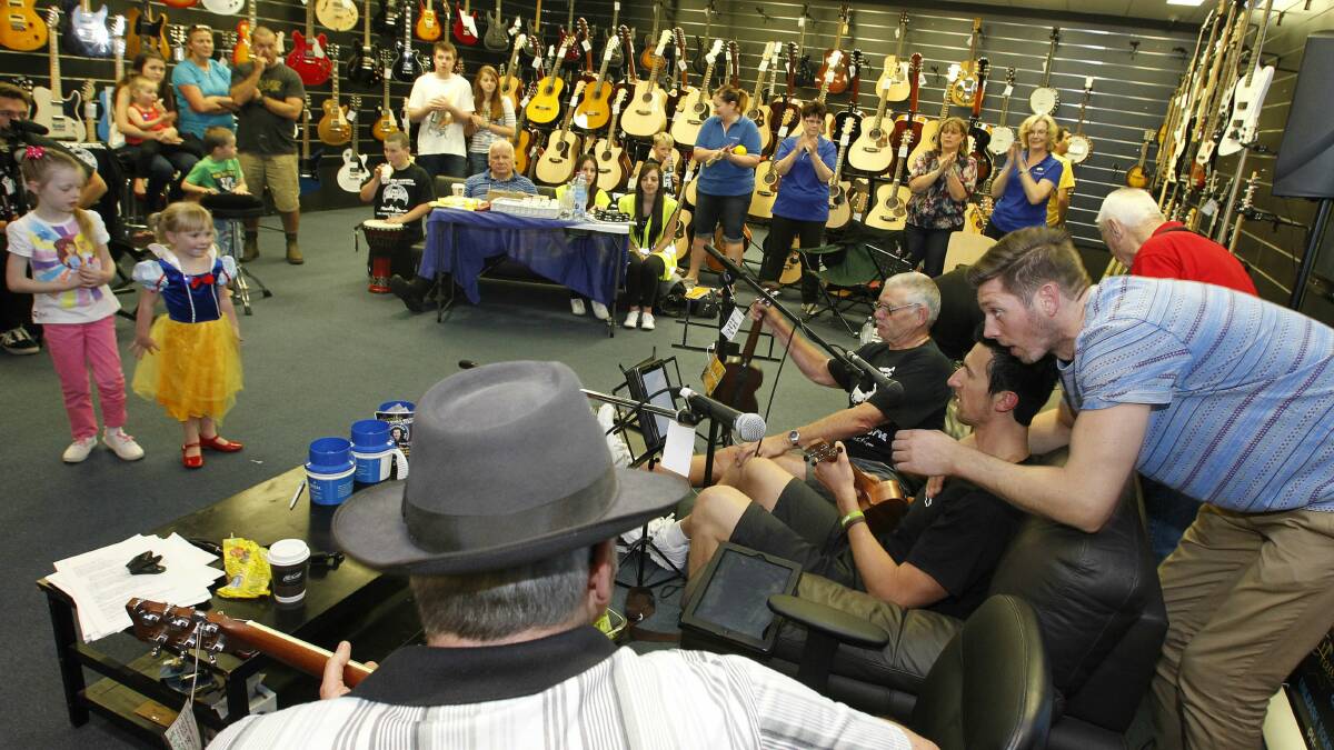 Glenn Haworth completes a world record attempt for playing ukelele 25 hours straight.