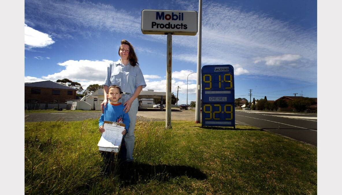 Kiama Heights Petroleum manager Jenny Harris and her nephew, Joel, with a 1600-strong petition to save Kiama's service stations.
