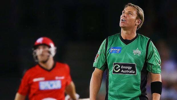 Shane Warne can only watch as Aaron Finch hits him for six on Friday night. Photo: Getty Images