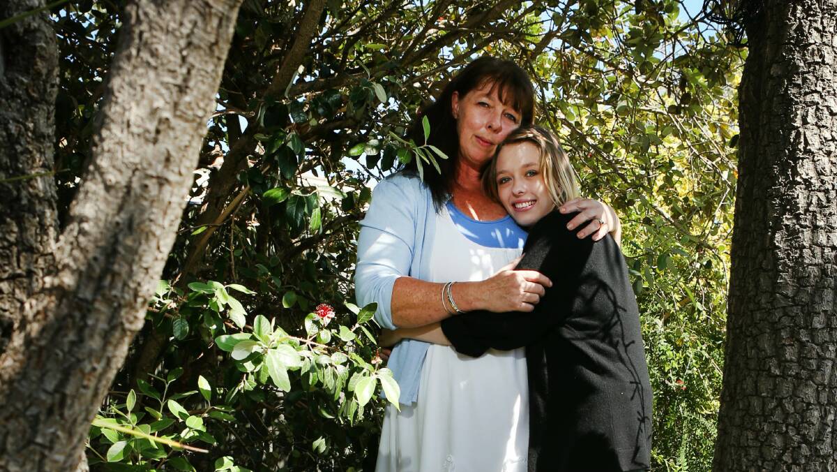Mindfulness instructor Bridget Dougherty hugs her daughter Katie. Picture: KIRK GILMOUR
