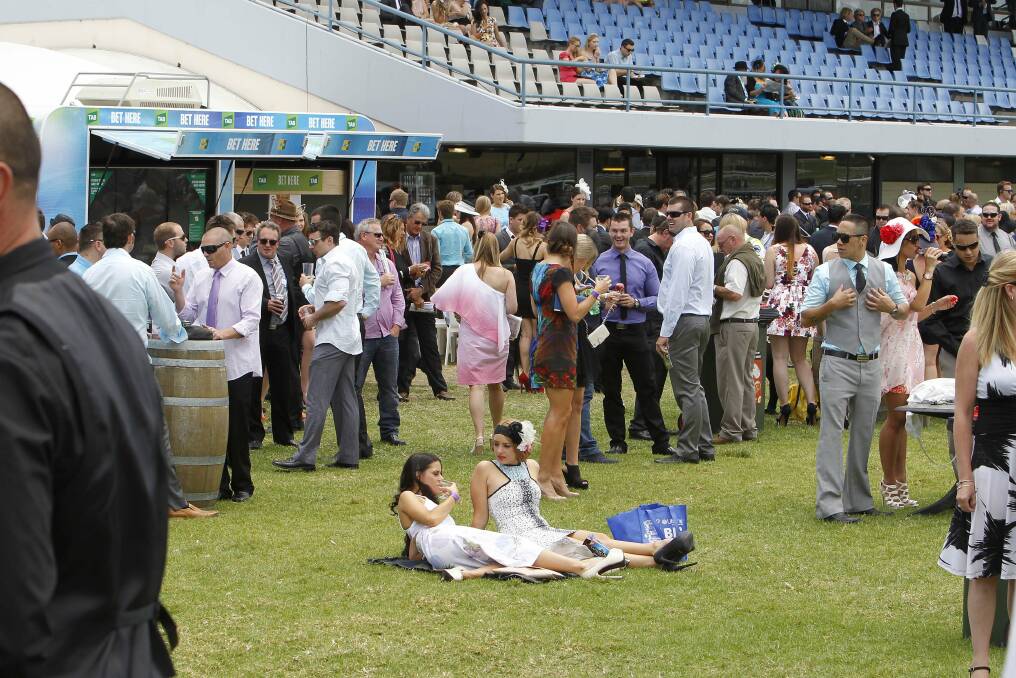 Crowds gather for drinks and nibbles as the day gathers momentum. Picture: ANDY ZAKELI