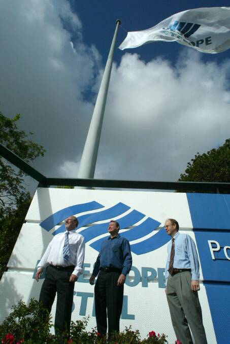 Executives raise the new flag over BlueScope Steel as the BHP name disappeared off the industrial landscape.