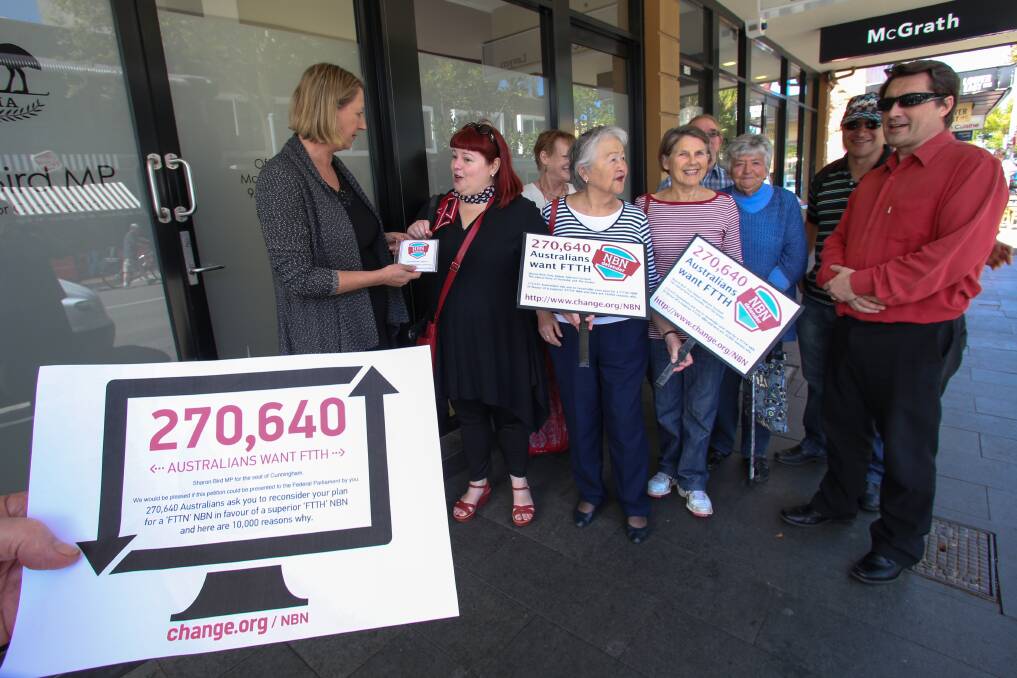 Fibre-to-the-premises supporters hand a petition in favour of the NBN to federal MP Sharon Bird at her Wollongong office. Picture: ADAM McLEAN 
