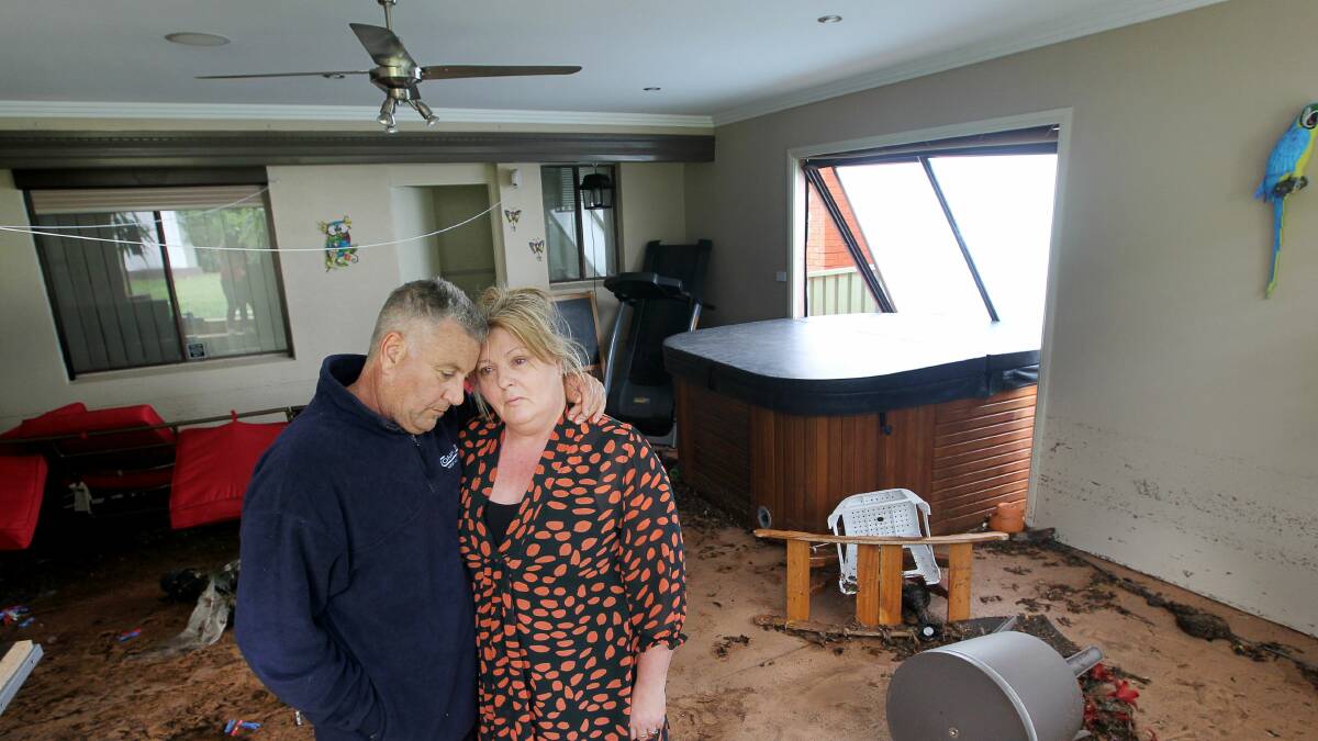 Jean and Frank Lamacchia in their wrecked home at Mount Warrigal. Picture: SYLVIA LIBER