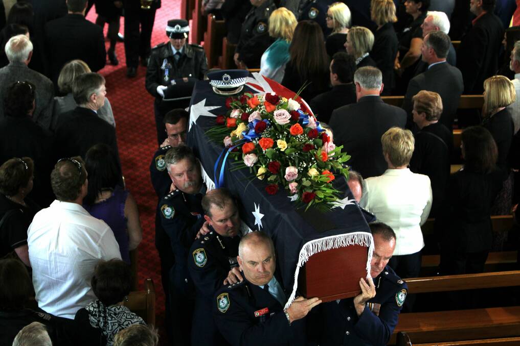 Loved ones, officers and members of the cycling community pay their last respects to Chief Inspector Graeme Donnelly. 